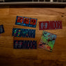 Sticker Pack 01 holographic sticker collection displayed on wooden desk