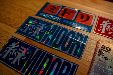 Close up of Sticker Pack 01 holographic vinyl designs with bold graphic artwork