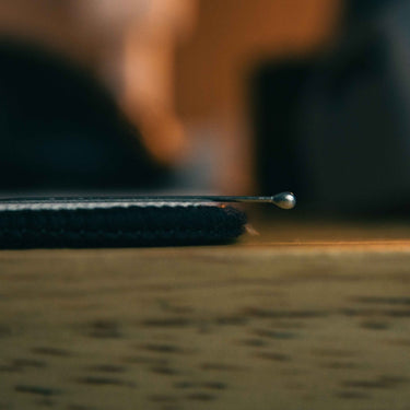 Stitched edge and thickness profile of The Girl cloth mousepad